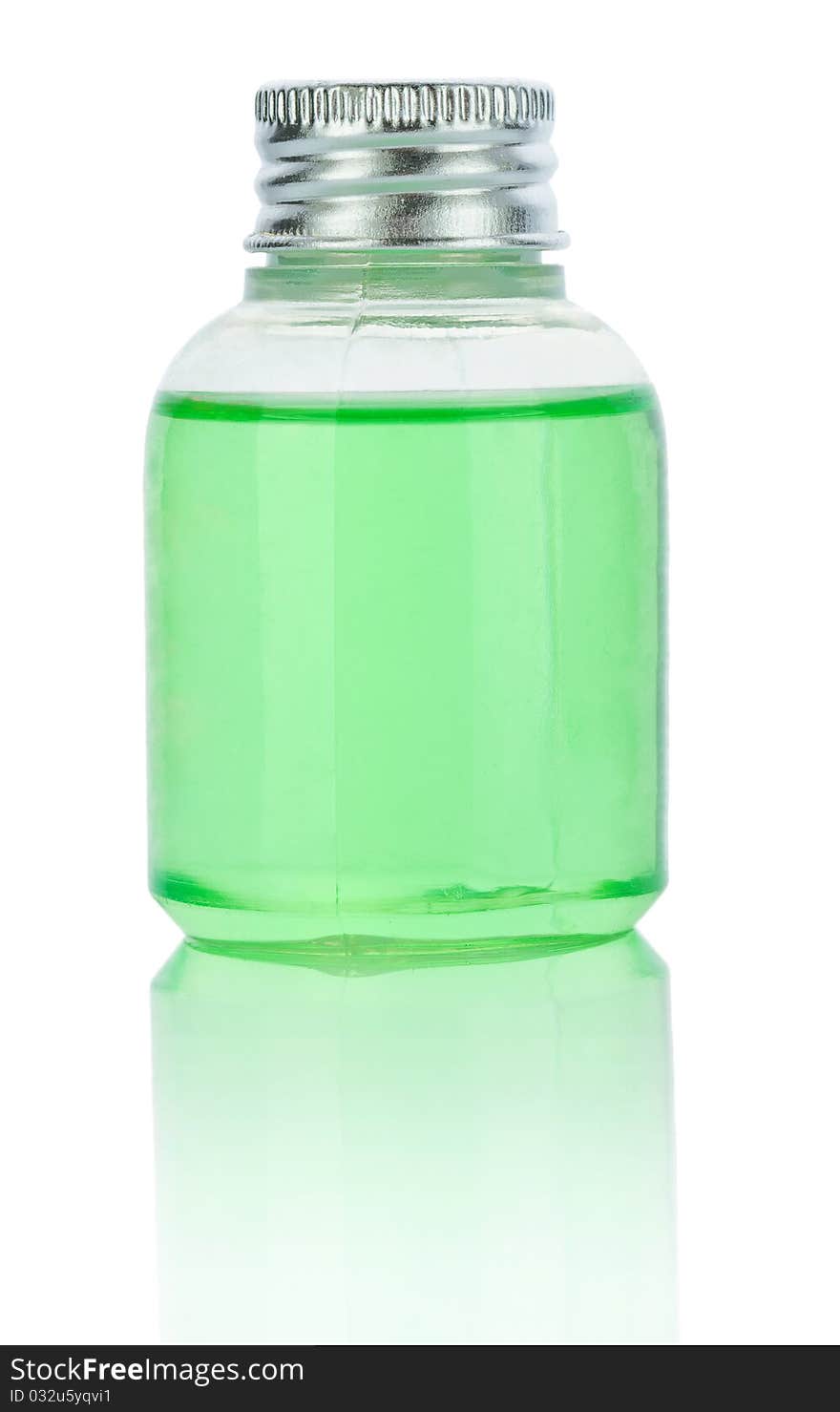 Transparent plastical bottle with green liquid