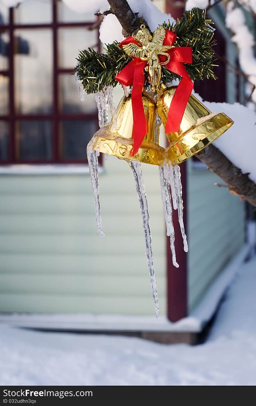 Icicles on golden christmas bells. Icicles on golden christmas bells