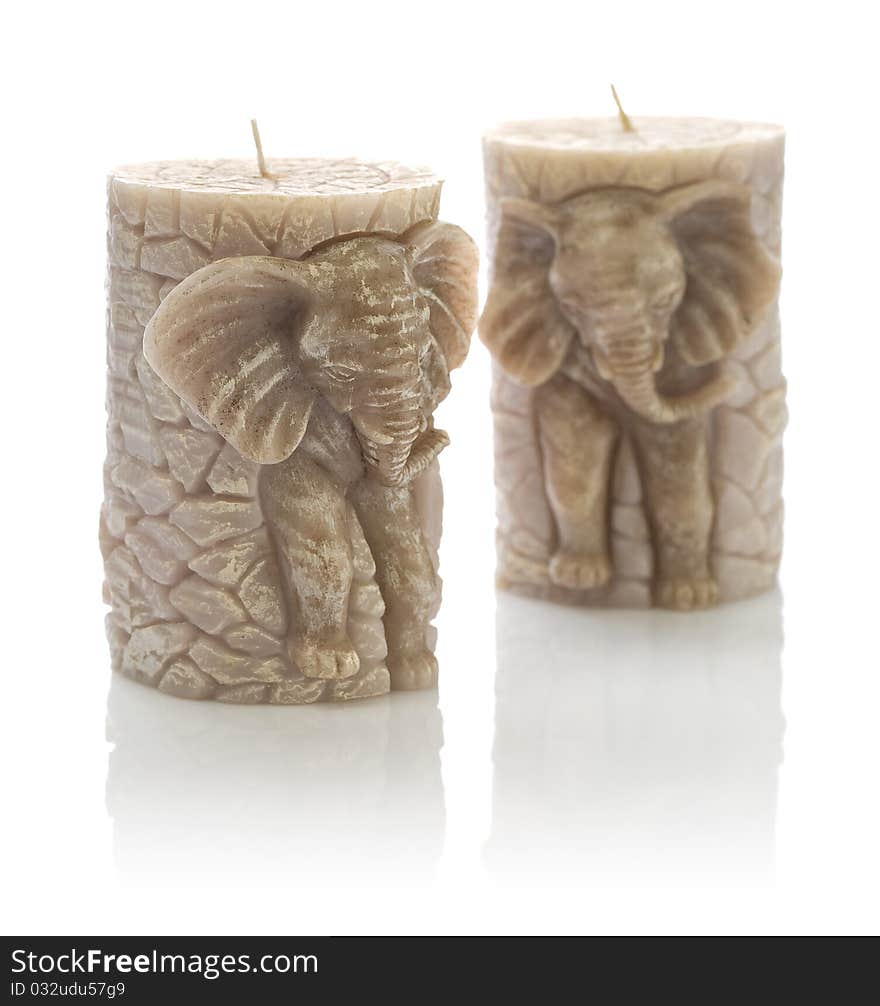 Studio shot two candles on the form of elefant on white background