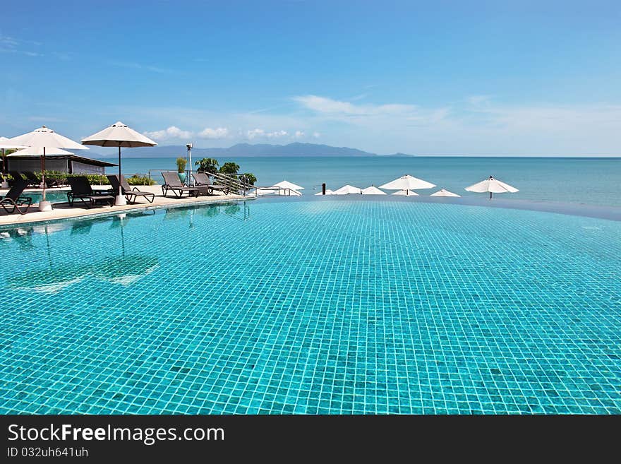 Tropical resort. Poolside and a sea view