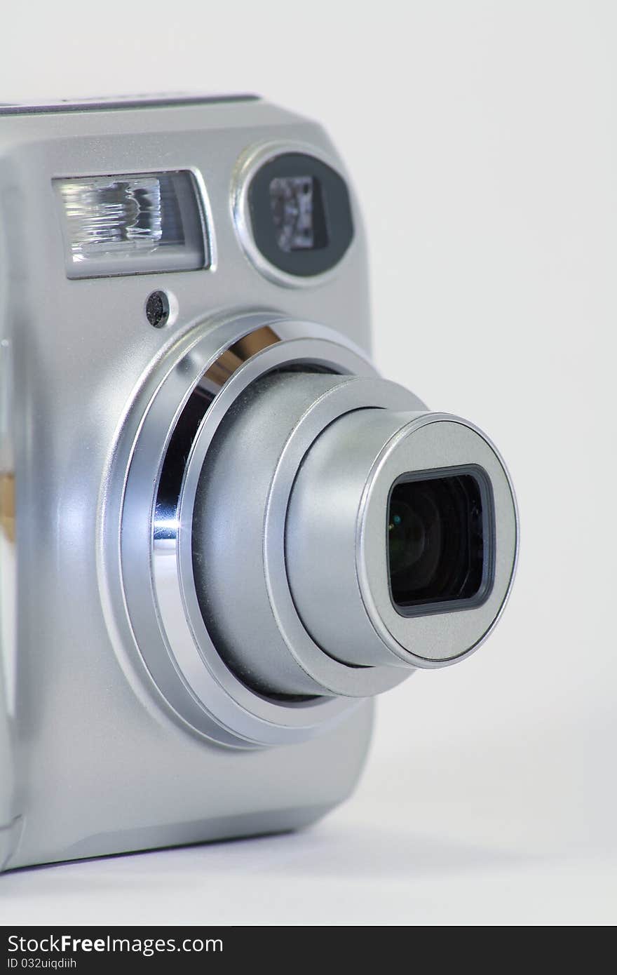 Digital Camera with Zoom Lens, white isolated background.