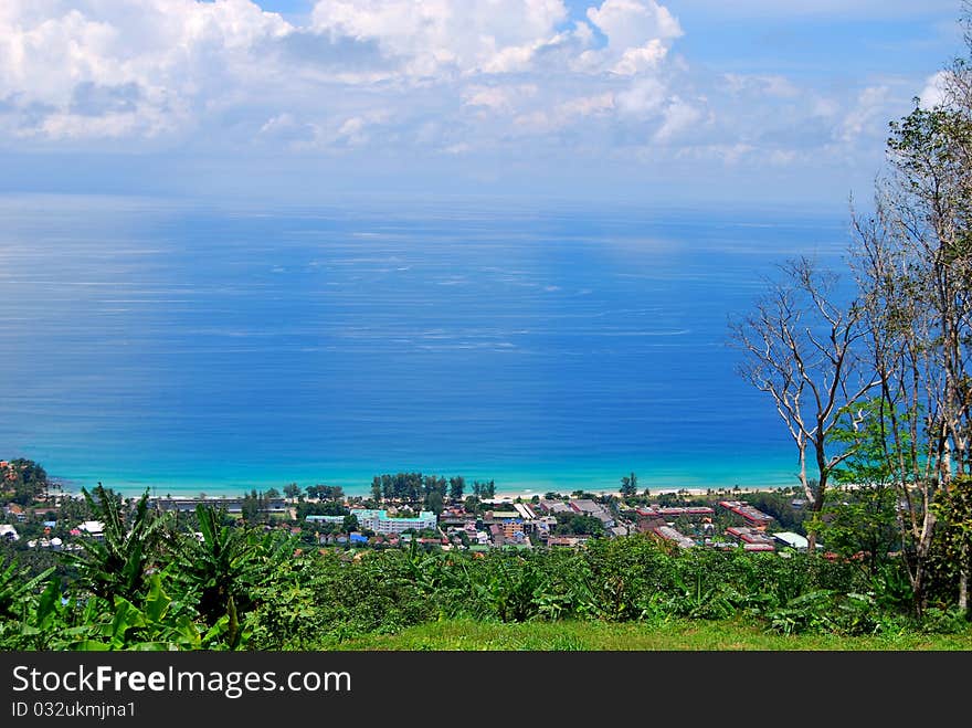 Beautiful beach view from mountainswith crystal clear blue waters and palm, banana trees on Phuket island. Beautiful beach view from mountainswith crystal clear blue waters and palm, banana trees on Phuket island