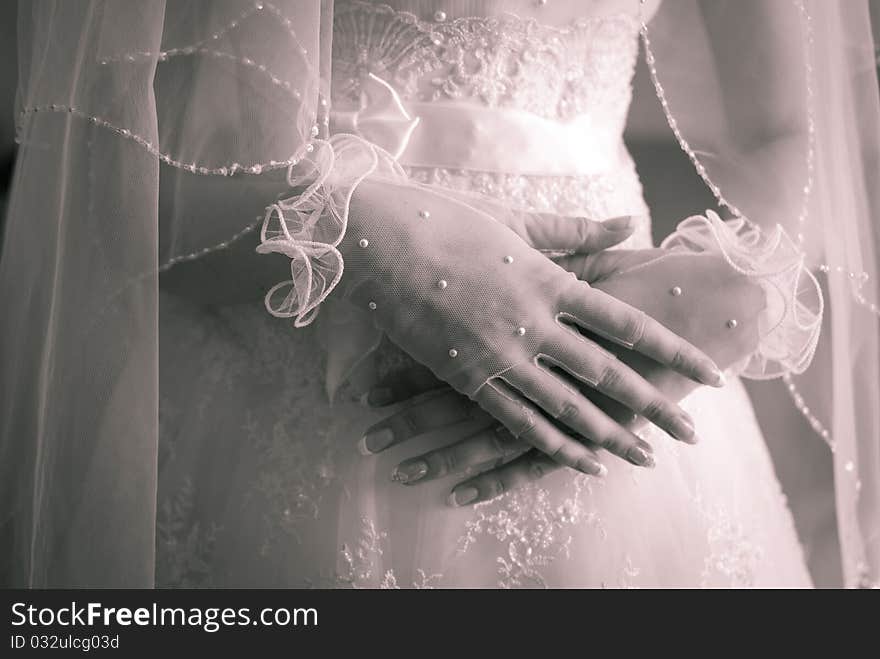 Wedding. Hands of the bride close up.