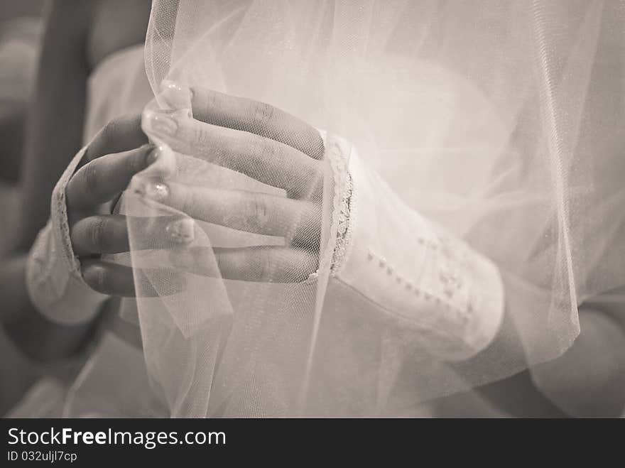 Wedding. Hands of the bride close up.