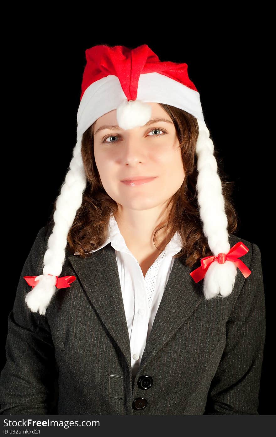 Beautiful young woman in red wearing santa hat. Isolated on white background.