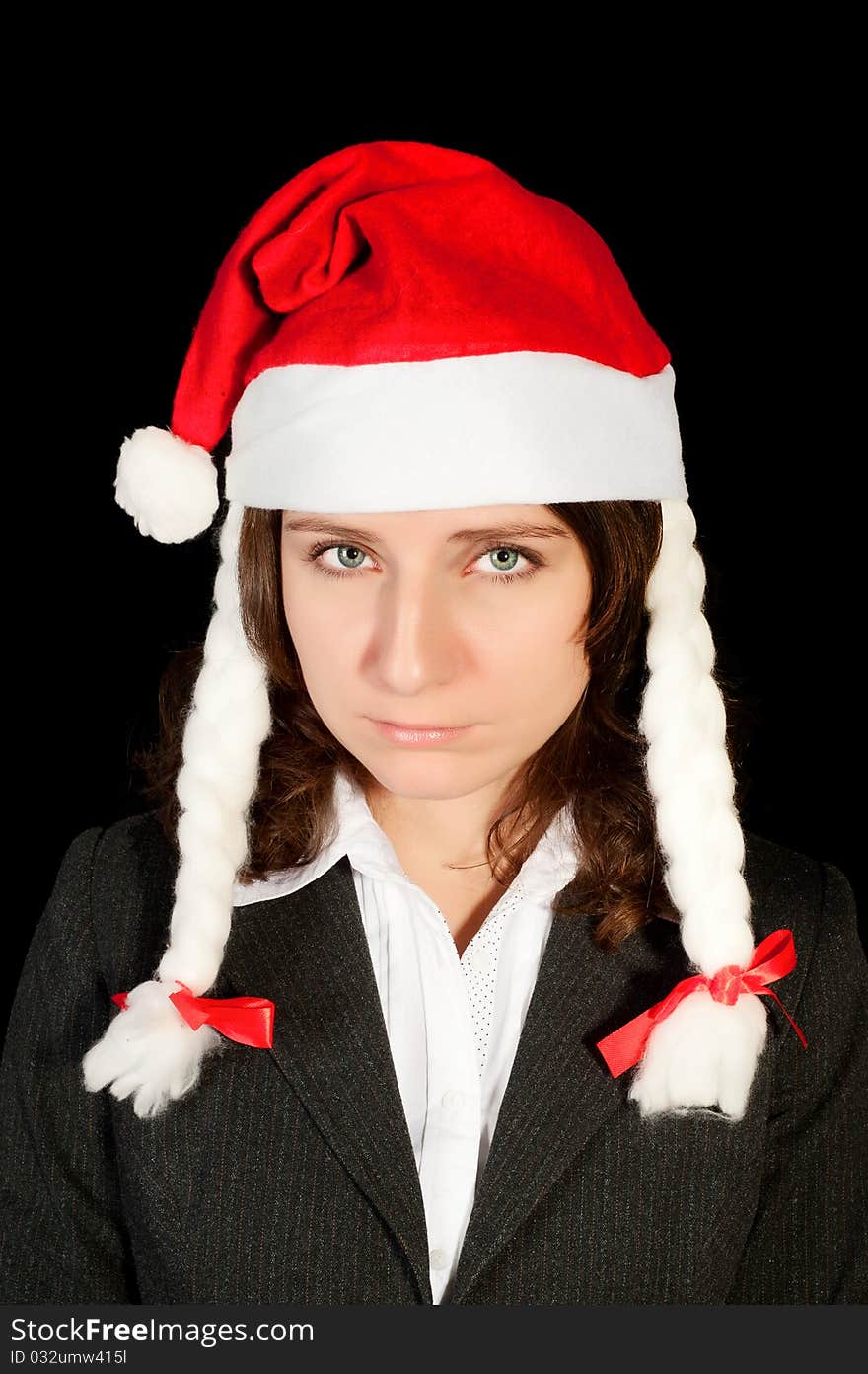 Beautiful young woman in red wearing santa hat. Isolated on white background.