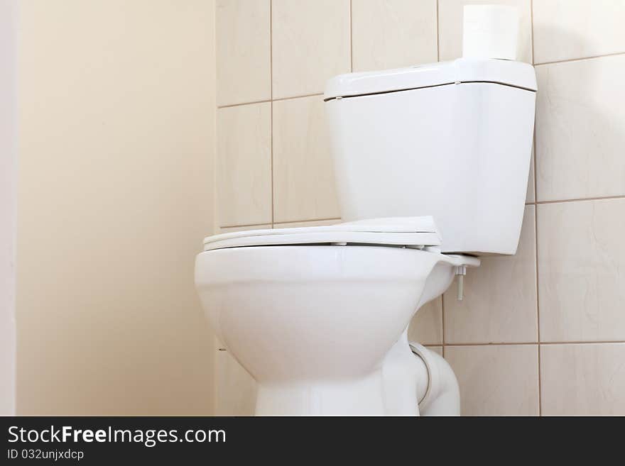 Clean and white toilet in a bathroom