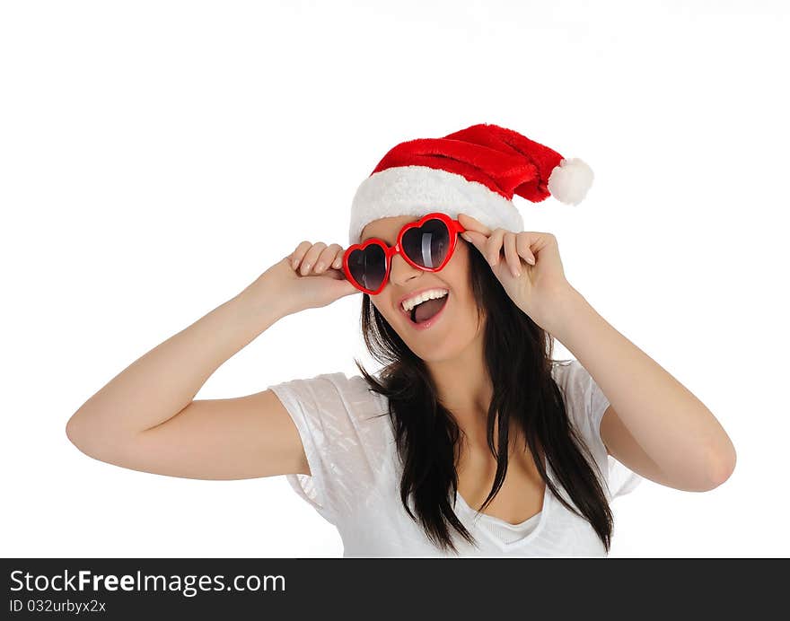 Funny sexy santa clouse woman in casual clothes, hat and red heart shaped glasses. isolated