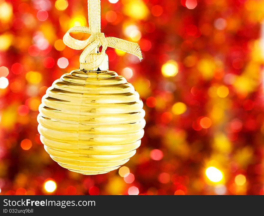 Christmas ball on red blurred background. Christmas ball on red blurred background