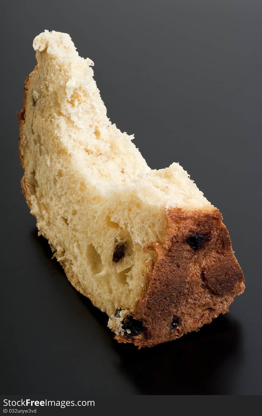 Slice of cake on a black table