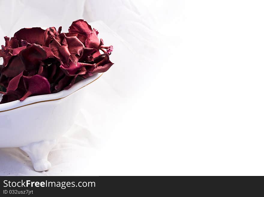 Christmas  red, white and purple potpourri flowers on white bath and white background. Christmas  red, white and purple potpourri flowers on white bath and white background