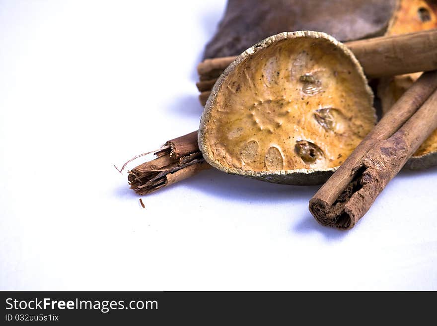 Oranges And Cinnamon Sticks On White Background