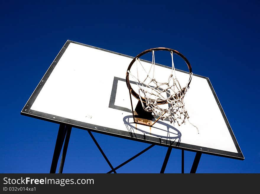 Basket backboard against blue sky in a park