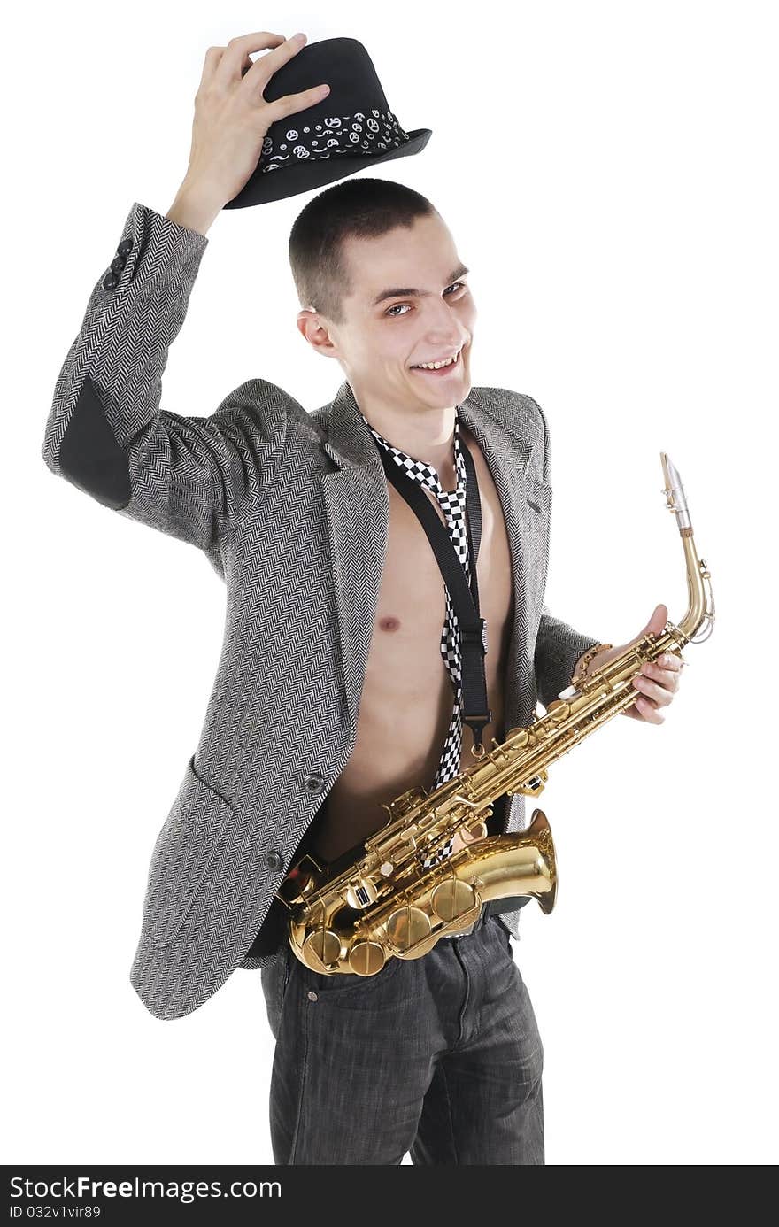 The young jazzman with saxophone takes off a hat. The young jazzman with saxophone takes off a hat