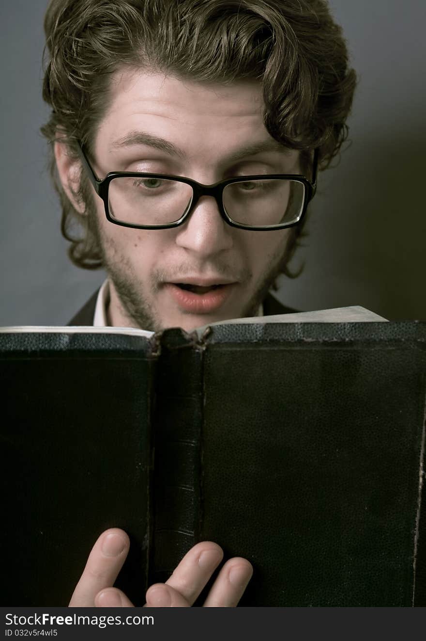 Young Man Reading A Book