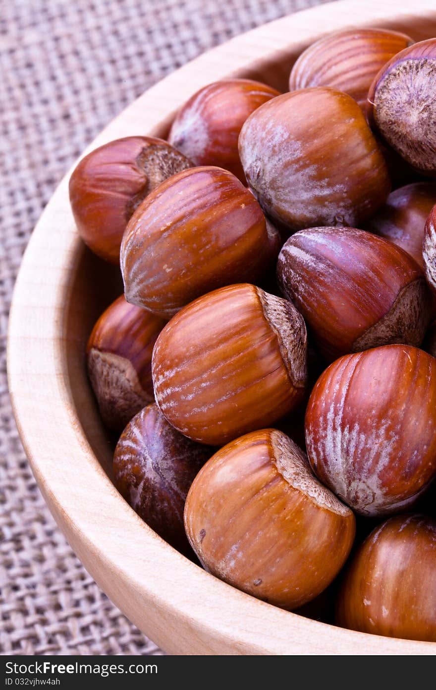 Selection of Hazelnuts in a wooden bowl