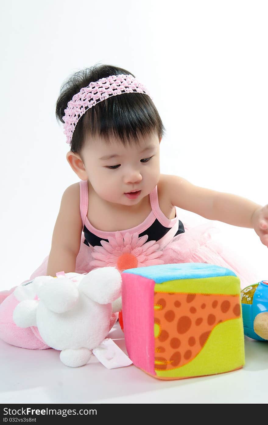 Kid wear in pink dress on floor. Kid wear in pink dress on floor