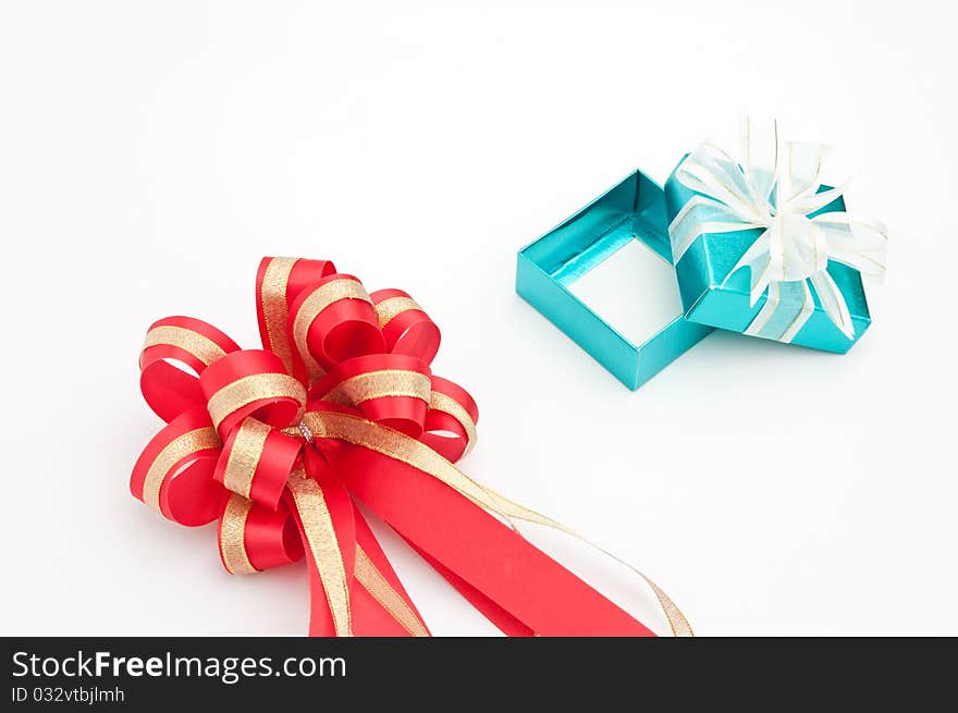 Red ribbon with cyan gift box