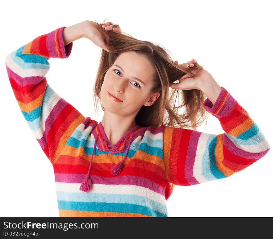 Young happy woman smiling grabs her hair