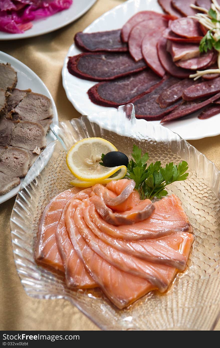 Fish delicacies on a festive table for a banquet. Fish delicacies on a festive table for a banquet.