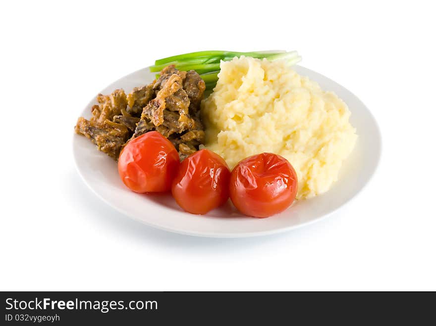 Cooked potatoes with liver and vegetables on the table (Path). Cooked potatoes with liver and vegetables on the table (Path)