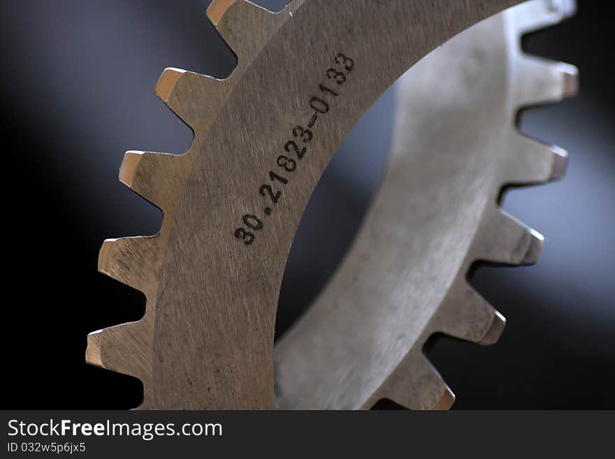 Cog wheels against dark background