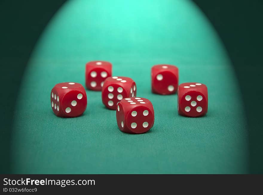 Red dice on the green gambling table. Red dice on the green gambling table