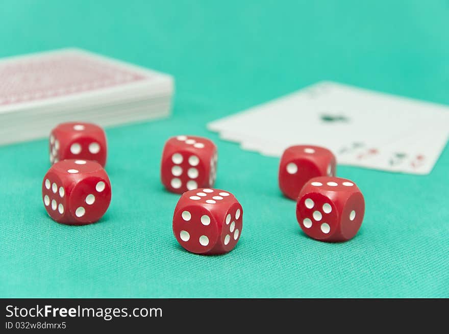 Winning poker hand of four aces playing cards, chips and red dices on green background. Winning poker hand of four aces playing cards, chips and red dices on green background