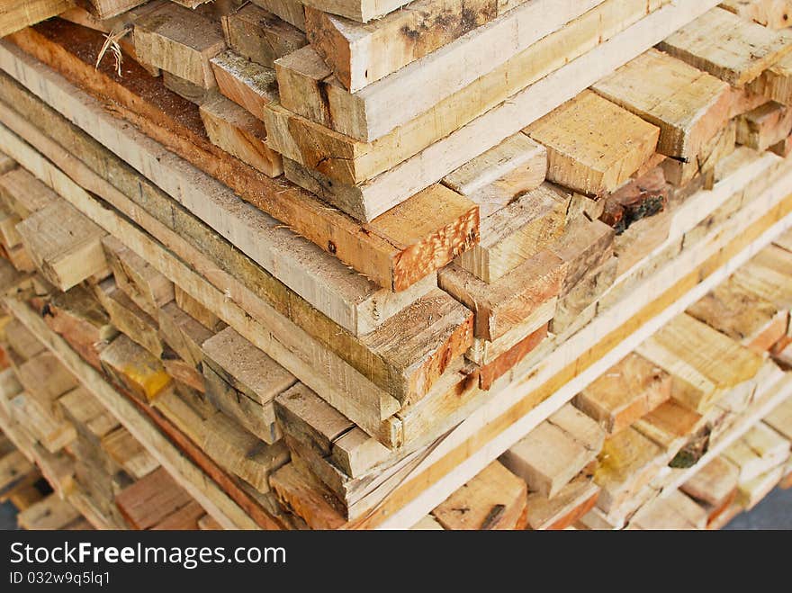 Stack of lumber in logs storage closeup