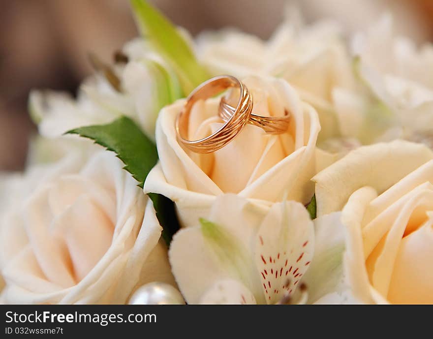 Wedding rings on a rose