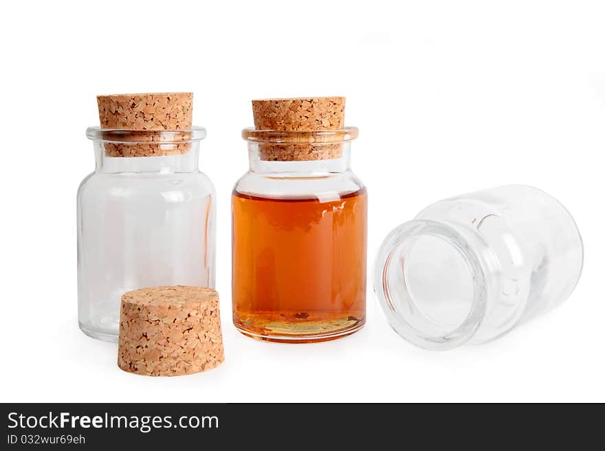 Empty and full glass bottle with cork stopper isolated on a white background