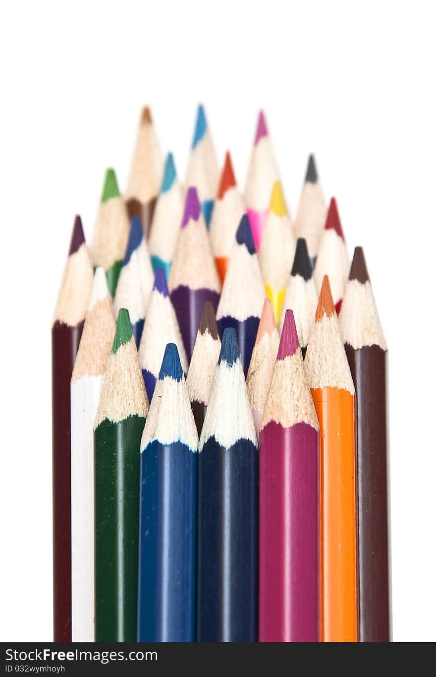 Closeup stack of colored pencils isolated on white background