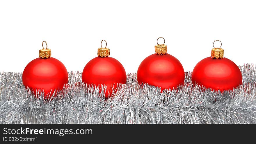 Red matt christmas balls on tinsel with space for your text