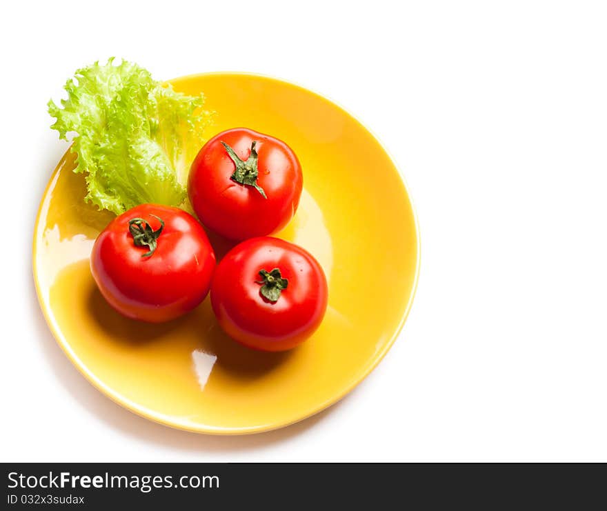 Tomato and lettuce on a dish