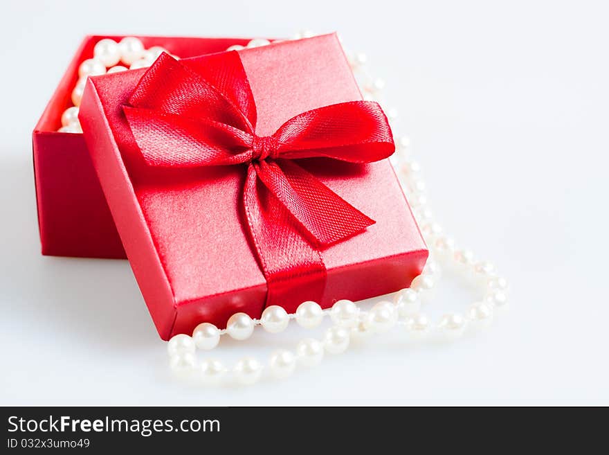 Gift with beads in the red packing