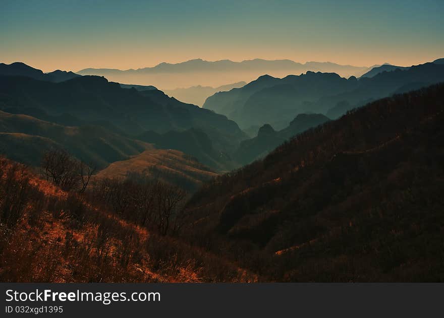 Mountain landscape with clouds and fog.