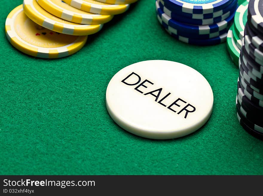 Poker dealer button and chips