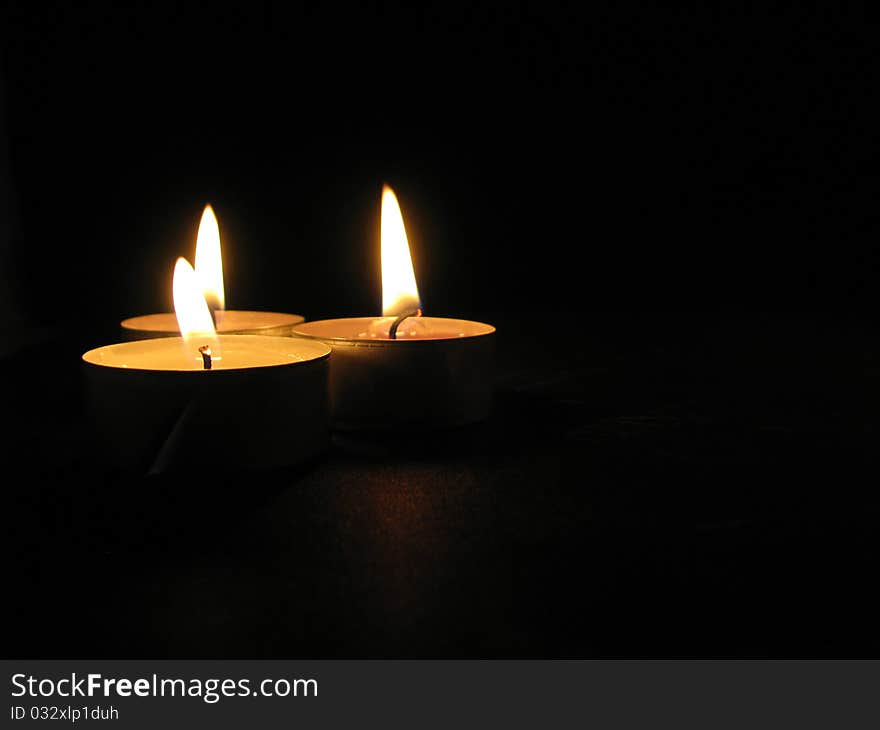 Candles on the black background