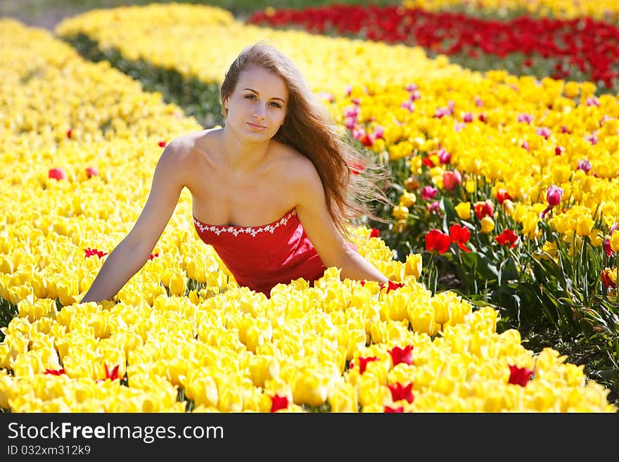 Attractive woman in tulip field