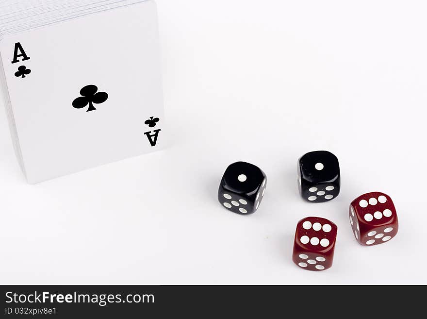 Subject excitement - on a white background a deck of cards and game cubes.