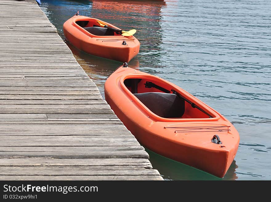 Two orange kayak