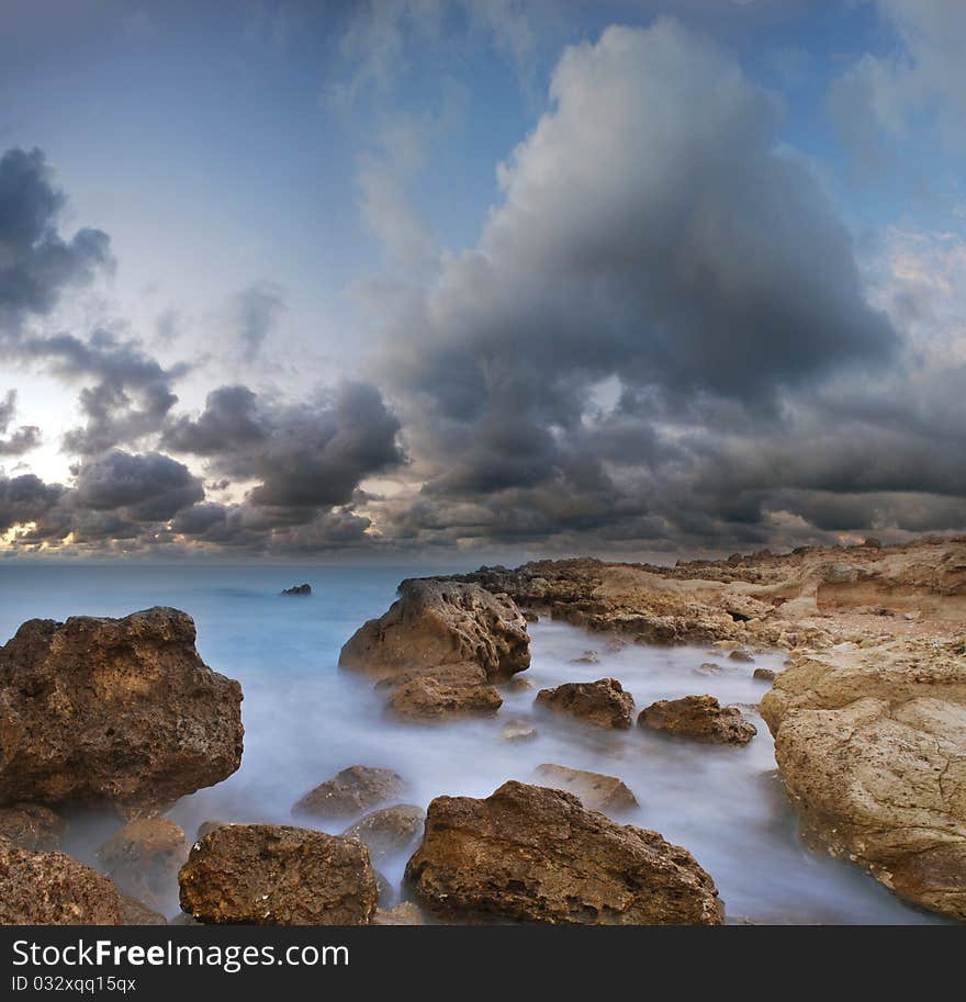 Summer sea coast, a sunset over the sea