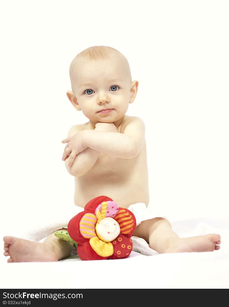 Baby portrait with flower toy on white background