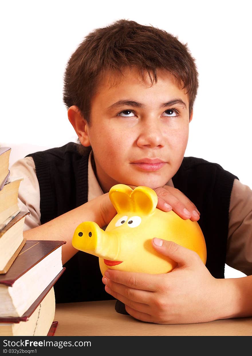 A boy and a piggy bank on white background isolated