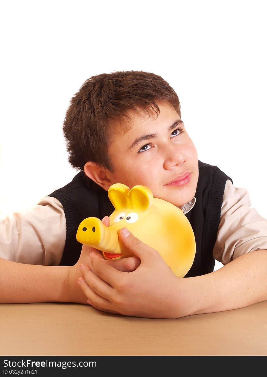 A boy and a piggy bank on white background isolated