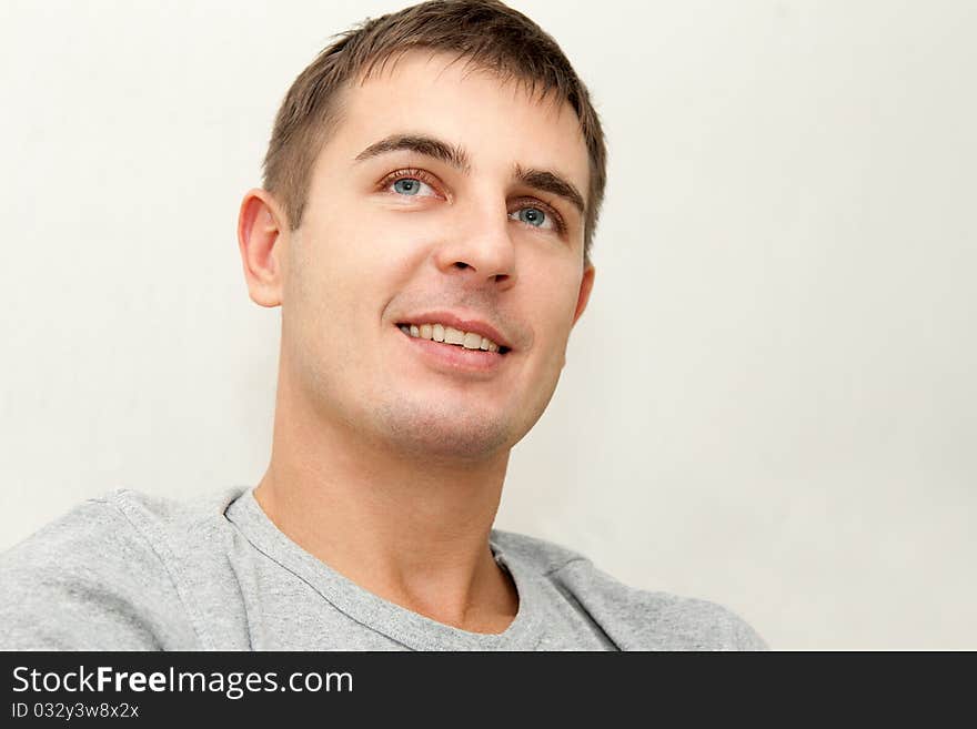 Portrait of a young handsome man on white background