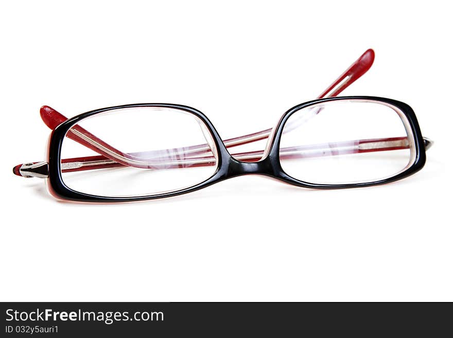 Stylish red glasses on a white background