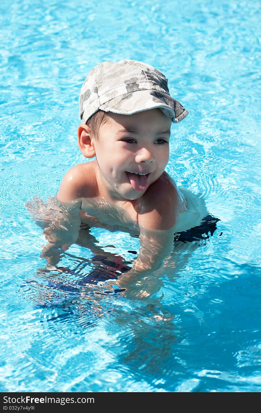 Little joy boy swims in the sea