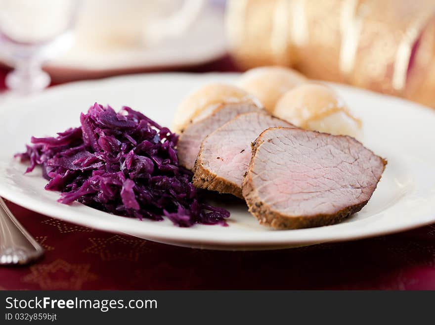 Roast pork with potato dumplings and red cabbage. Roast pork with potato dumplings and red cabbage