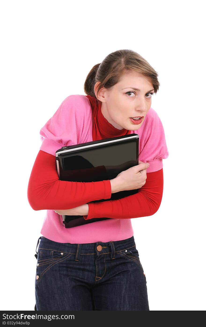 The woman presses to itself the laptop over white. Emotion of greed